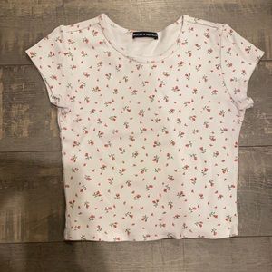 white crop top, pink floral pattern from Brandy Melville.